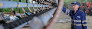 Devoran Metals employee shows Steel Reinforcement Bars for Concrete Reinforcement at the Workshop in Truro, Cornwall.